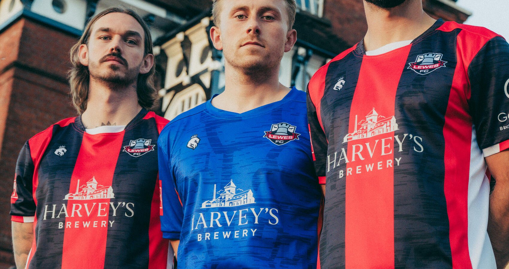 Lewes FC Players Tom Bender, Louis Rogers, Andrew Briggs in front of Harvey's Brewery