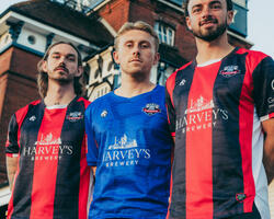 Lewes FC Players Tom Bender, Louis Rogers, Andrew Briggs in front of Harvey's Brewery